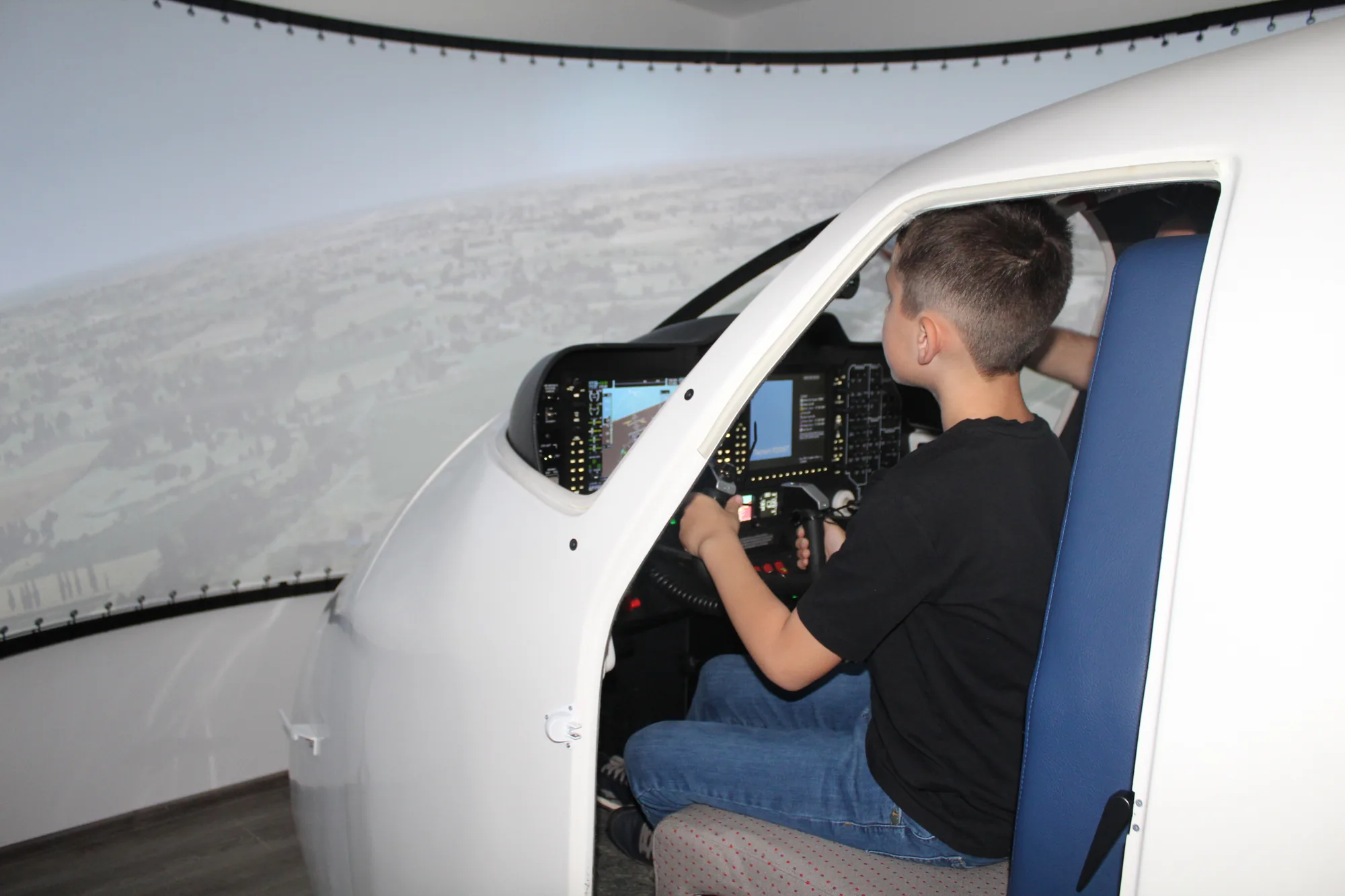 Child at the controls of the SEP simulator
